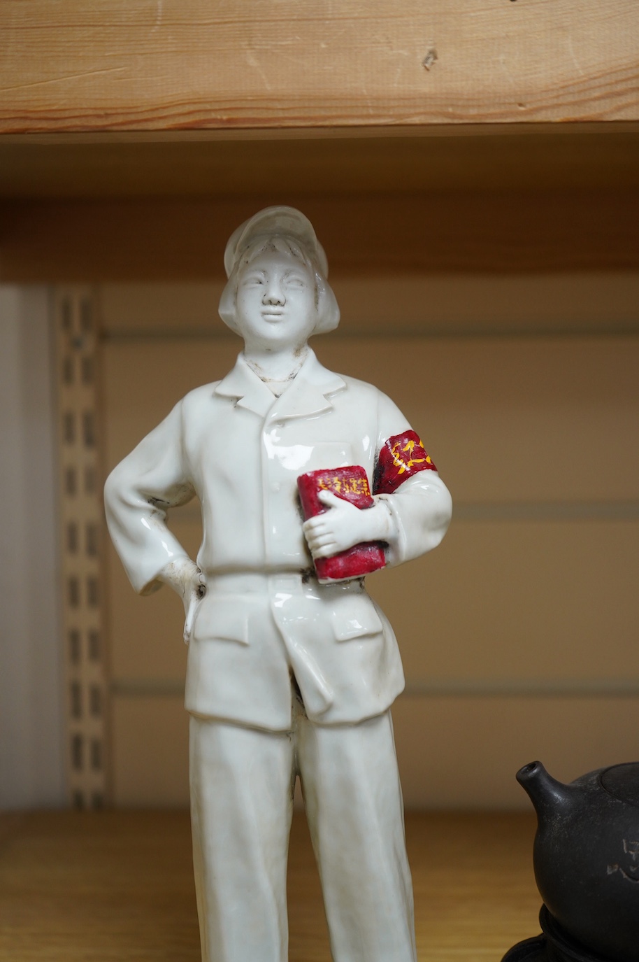 A Chinese cultural revolution Communist party figure together with a Mao teapot and three tea bowls, largest 31cm high. Condition - good